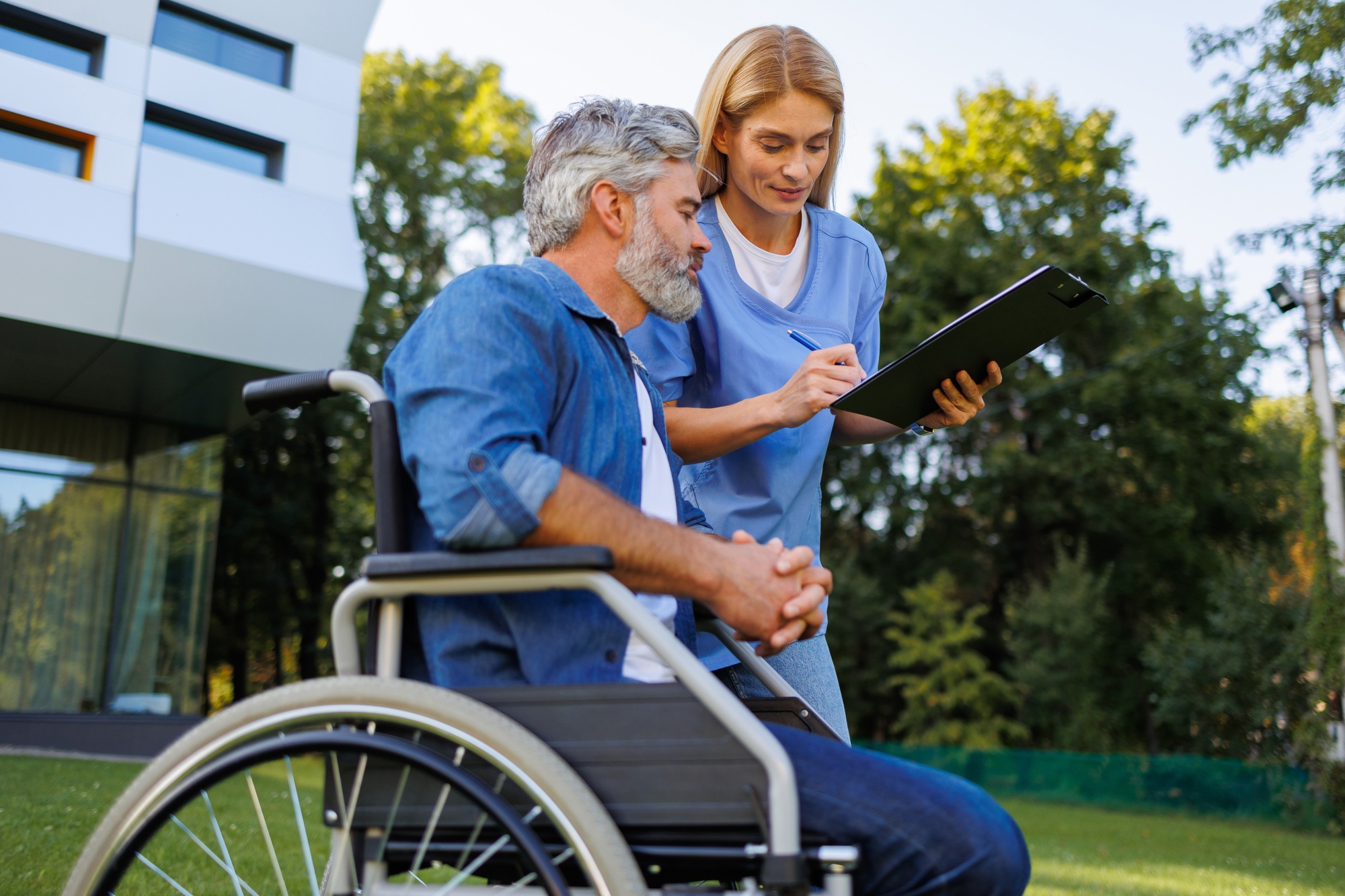 Inclusive Healthcare: Nurse Supports Patient Outdoors